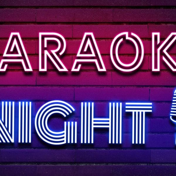 Neon sign on a brick wall reads "KARAOKE NIGHT!" with a microphone icon.